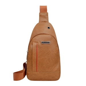 Brown PU leather chest bag for men with headphone port and adjustable strap on white background