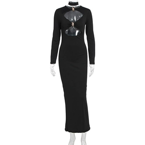 Detail of sexy cutout bodice with gold metal buckles on a slim black long dress