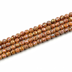 Macro detail of faceted agate beads with 10mm round cut and sparkling orange finish