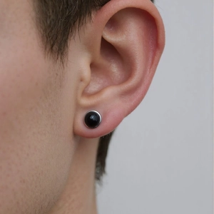 Minimalist S925 sterling silver studs with black round stone worn by a model