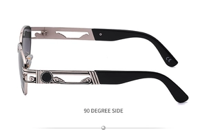 Detail view of steampunk gunmetal sunglasses with hollowed floral carvings on temples