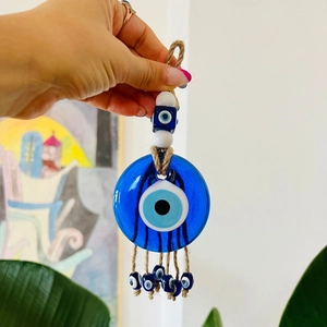 Blue glass Turkish evil eye hanging ornament with rope tassels for home and car decor