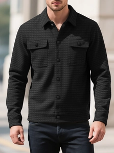Detail showing waffle texture and double chest pockets on black casual shirt jacket