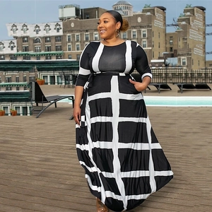 Plus size black and white striped geometric print midi dress with 3/4 sleeves and belted waist