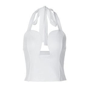 Detail view of white halter neck top with deep U-neckline and wide tie straps