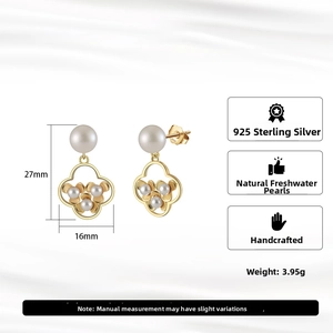 Detailed view of handmade S925 sterling silver petal earrings with natural freshwater pearls
