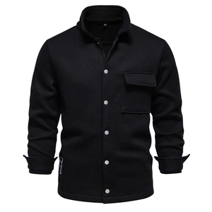 Close-up of black waffle knit texture with silver metal snap buttons on a men jacket