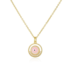Macro shot of gold-plated necklace with pink evil eye pendant and zircon diamonds