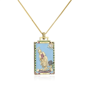 Macro detail of 18K gold plated tarot necklace with Strength engraving and enamel