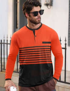 Outdoor shot of men's slim fit long sleeve Henley shirt with orange and black stripes