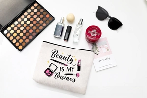 Detail of waterproof canvas makeup bag with beauty slogan and lifestyle accessories
