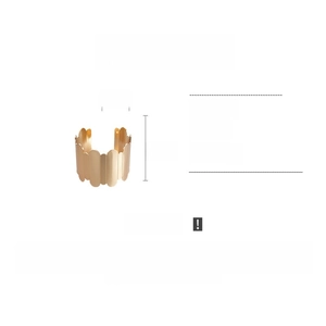 Detail showing dimensions of gold wavy metal cuff bracelet 6.5cm height and 4.9cm diameter