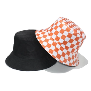 Detail view of cotton sun hats in solid black and orange checkered pattern options
