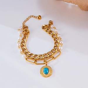 Layered gold stainless steel bracelet with white pearls and blue turquoise pendant