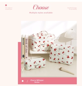 Three-piece quilted cotton cosmetic bag set with cherry pattern and secure zipper closure
