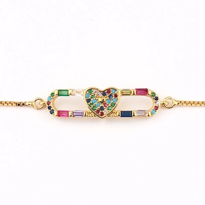 Golden box chain bracelet featuring a heart pendant and multicolor rectangular zircon stones