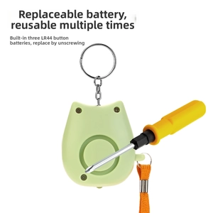 Detail showing the replacement of three LR44 button batteries in the owl safety alarm