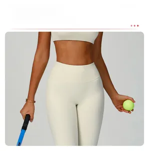 Detail of high-waist cream yoga leggings showing seamless front and athletic fit
