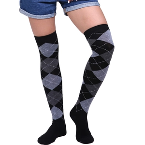 Close-up of black and grey argyle pattern on elastic over-the-knee socks for women
