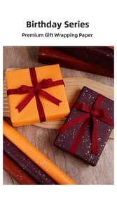 Detail of luxury gift wrapping paper with gold foil accents in orange and purple tones