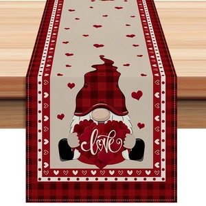 Detail view of Valentine's gnome table runner with red buffalo plaid pattern on wood