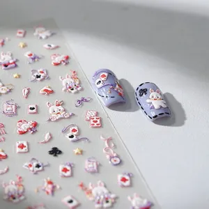 Detail of 3D embossed nail stickers with white rabbits and playing cards on nail tips