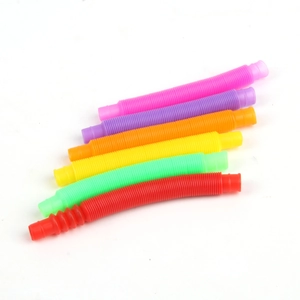 Close-up of six colorful stretch tubes in pink, purple, orange, yellow, green and red colors