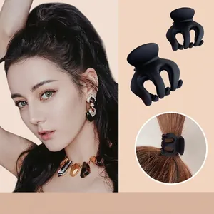 Matte black high ponytail hair claw clip with firm grip for secure hairstyling