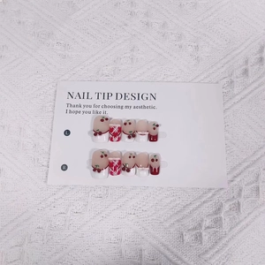 Handmade Christmas press-on nails set with 3D cherry, red bow, and pearl details