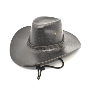 Detail of leaf pattern embossing on black PU leather cowboy hat with braided rope