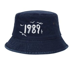 Detail of navy blue washed canvas baseball cap with 1989 embroidery and metal eyelets