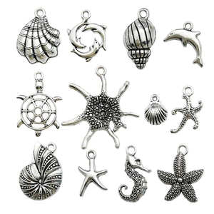 Set of 12 antique silver ocean creature alloy charms including turtle, dolphin and starfish