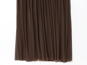 Detail shot of sheer dark brown mesh fabric showing vertical pleated texture and drape