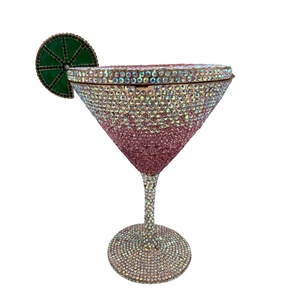 Close-up of luxury martini glass clutch bag with pink gradient crystals and lemon detail