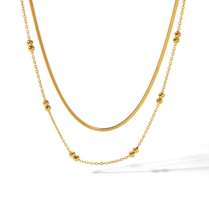 Double-layered gold stainless steel necklace with flat snake chain and beaded cross chain
