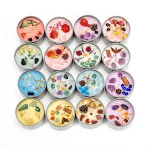 Set of 16 assorted handmade crystal and dried flower scented soy candles in tin cans
