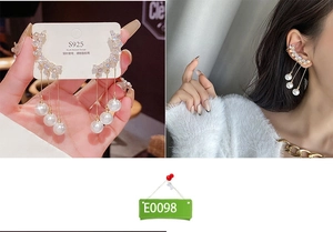 Detail of luxury S925 silver needle pearl tassel earrings with zircons and gold plating