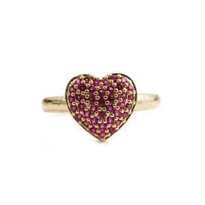 Detailed close-up of a heart-shaped ring with red zircon micro-pave in gold finish