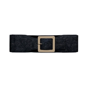 Detail of black elastic belt with embossed floral patterns and a gold square buckle