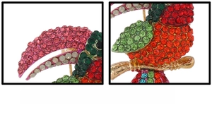 Close-up of vintage parrot brooch with colorful rhinestones on a gold-plated base