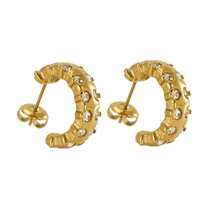 Detail of 18k gold plated C-shaped earrings with micro-paved sparkling cubic zirconia