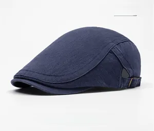 Close-up of navy blue beret cap showing high-quality canvas texture and side metal buckle