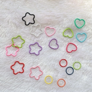 Colorful embossed jump rings in star heart and circle shapes for DIY jewelry making