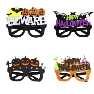 Set of four glitter Halloween decorative glasses featuring pumpkins, bats, and ghosts designs