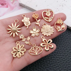 Set of 12 gold flower pendants including sunflower and rose charms for DIY jewelry making