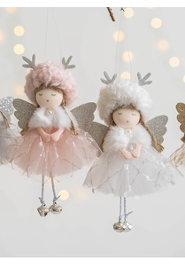 Detail of plush Christmas angel dolls with mesh skirts, antlers and silver metal bells