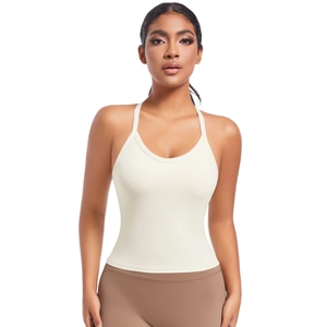 Vue de face du soutien-gorge de sport sans couture crème avec bretelles croisées yoga