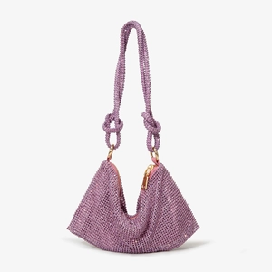 Detailed macro view of purple rhinestone handbag showing luxury crystals and gold zipper