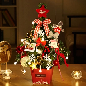 Mini pre-lit Christmas tree with red base and festive ornaments for tabletop decor