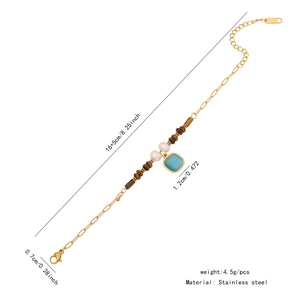 Detailed view of stainless steel bracelet with tiger eye beads and blue square pendant